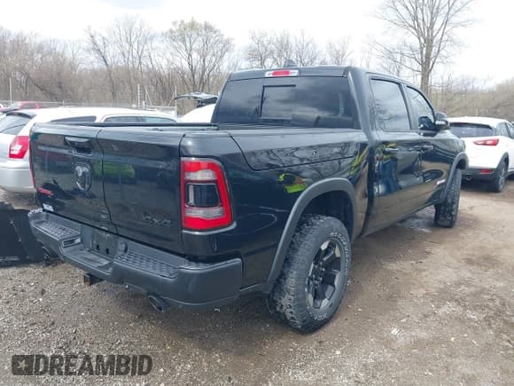 ✅ 2021 Ram 1500 Rebel • VIN: 1C6SRFLT2MN594758 • Lot: 41854893. Listed on IAAI with 54,012 mi. Free auction sales archive from the USA and detailed vehicle history report at DreamBid. Image 4.