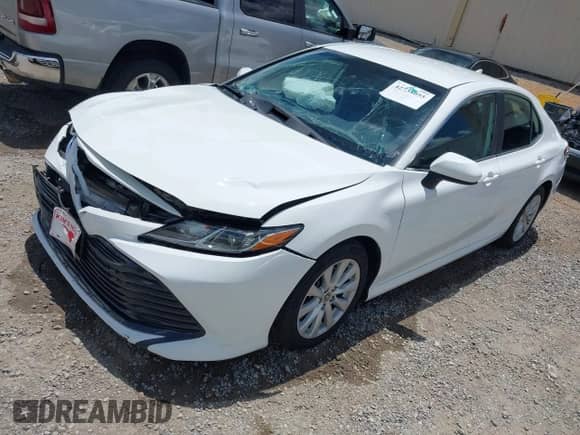 2020 Toyota Camry LE with VIN 4T1C11AK3LU952922, listed as a IAAI auction lot 42738055 with 90,401 mi miles and . Bid and sale history available at DreamBid. Image 2.