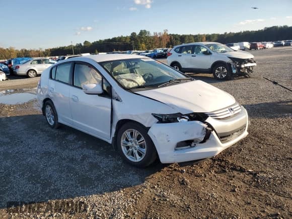 ✅ 2010 Honda Insight EX • VIN: JHMZE2H77AS036603 • Lot: 90609685. Listed on Copart with 141,149 mi. Free auction sales archive from the USA and detailed vehicle history report at DreamBid. Image 4.
