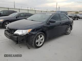2014 Toyota Camry SE with VIN 4T1BF1FK9EU324484, listed as a Copart auction lot 86872855 with 220,729 mi miles and Salvage title. Bid and sale history available at DreamBid. Image 1.