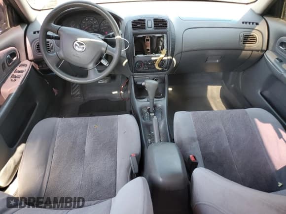 ✅ 2000 Mazda Protege ES • VIN: JM1BJ2239Y0268002 • Lot: 81656605. Listed on Copart with 233,894 mi. Free auction sales archive from the USA and detailed vehicle history report at DreamBid. Image 8.