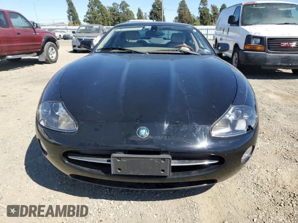 ✅ 2005 Jaguar XK • VIN: SAJDA41C152A43910 • Лот: 70783124. Опубликован ранее на Copart с пробегом 83 654 миль. Бесплатный доступ к архиву аукционных продаж из США и подробный отчёт об истории автомобиля на DreamBid. Изображение 5.