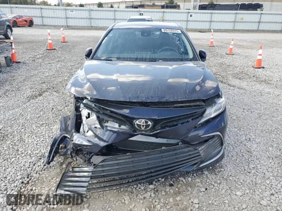 2022 Toyota Camry LE с VIN 4T1R11BK3NU060035, выставлен на аукционе Copart как лот 89728225 с пробегом 25 477 миль миль и Списание • Salvage title. История ставок и продаж доступна на DreamBid. Изображение 5.