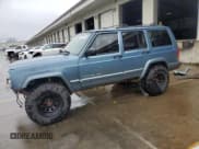 ✅ 1999 Jeep Cherokee Sport • VIN: 1J4FF68S4XL583029 • Lot: 52030175. Listed on Copart with 294,502 mi. Free auction sales archive from the USA and detailed vehicle history report at DreamBid. Image 1.