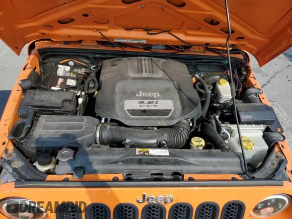 2012 Jeep Wrangler Sport z VIN 1C4AJWAGXCL187041, wystawiony jako Copart lot #71404335 z przebiegiem 127 412 mil mil oraz Szkoda całkowita • Salvage title. Historia ofert i sprzedaży dostępna na DreamBid. Obrazek 11.