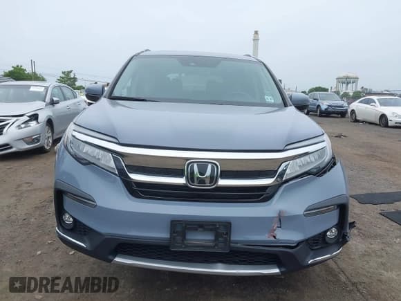 ✅ 2022 Honda Pilot Touring 7-Passenger • VIN: 5FNYF6H68NB056077 • Lot: 42357338. Listed on IAAI with 18,193 mi. Free auction sales archive from the USA and detailed vehicle history report at DreamBid. Image 12.