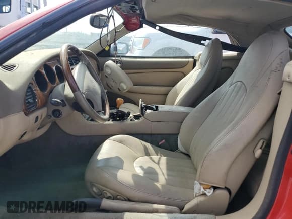 ✅ 1999 Jaguar XK • VIN: SAJGX2044XC038236 • Lot: 81923635. Listed on Copart with 44,616 mi. Free auction sales archive from the USA and detailed vehicle history report at DreamBid. Image 7.