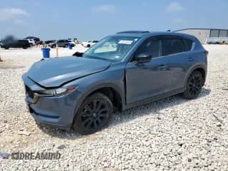 ✅ 2021 Mazda CX-5 Carbon Edition • VIN: JM3KFACYXM0382307 • Lot: 58743045. Listed on Copart with 95,118 mi. Free auction sales archive from the USA and detailed vehicle history report at DreamBid. Image 1.