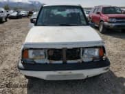 ✅ 1995 Suzuki Sidekick • VIN: JS3TD03V4S4113472 • Lot: 51279074. Listed on Copart with 199,736 mi. Free auction sales archive from the USA and detailed vehicle history report at DreamBid. Image 5.