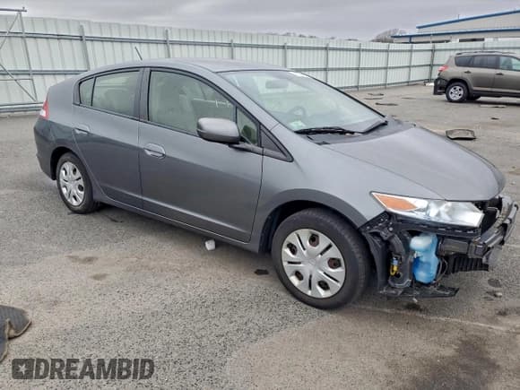 ✅ 2014 Honda Insight • VIN: JHMZE2H37ES002695 • Lot: 95284125. Listed on Copart with 122,869 mi. Free auction sales archive from the USA and detailed vehicle history report at DreamBid. Image 4.