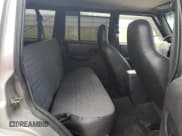 ✅ 2001 Jeep Cherokee • VIN: 1J4FT28S71L507698 • Lot: 57991985. Listed on Copart with Not provided. Free auction sales archive from the USA and detailed vehicle history report at DreamBid. Image 10.