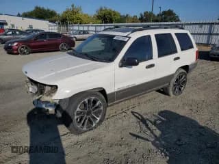 ✅ 2000 Jeep Grand Cherokee Laredo • VIN: 1J4GW48S1YC219872 • Lot: 80507585. Listed on Copart with 199,741 mi. Free auction sales archive from the USA and detailed vehicle history report at DreamBid. Image 1.