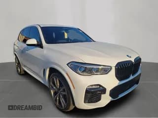 ✅ 2020 BMW X5 M50i • VIN: 5UXJU4C0XLLE45698 • Лот: 84193075. Опубликован ранее на Copart с пробегом 105 202 миль. Бесплатный доступ к архиву аукционных продаж из США и подробный отчёт об истории автомобиля на DreamBid. Изображение 1.