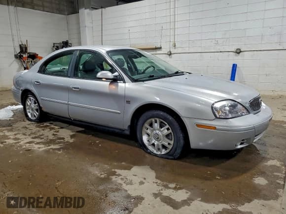 ✅ 2004 Mercury Sable LS Premium • VIN: 1MEFM55S64G607215 • Lot: 94497595. Listed on Copart with 113,980 mi. Free auction sales archive from the USA and detailed vehicle history report at DreamBid. Image 4.
