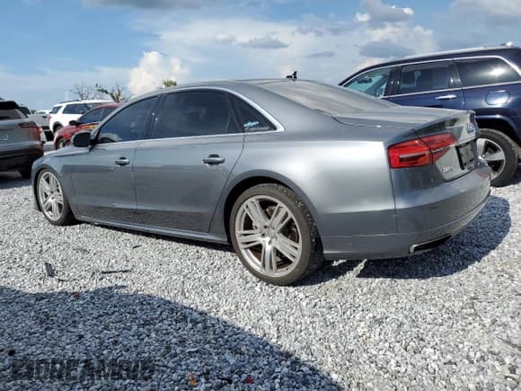 ✅ 2016 Audi A8 Sport • VIN: WAU43AFD8GN008513 • Lot: 68793975. Listed on Copart with 76,071 mi. Free auction sales archive from the USA and detailed vehicle history report at DreamBid. Image 2.