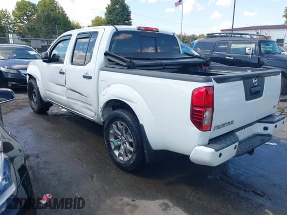 ✅ 2021 Nissan Frontier SV • VIN: 1N6ED0EA2MN705285 • Lot: 43180960. Listed on IAAI with 35,576 mi. Free auction sales archive from the USA and detailed vehicle history report at DreamBid. Image 3.