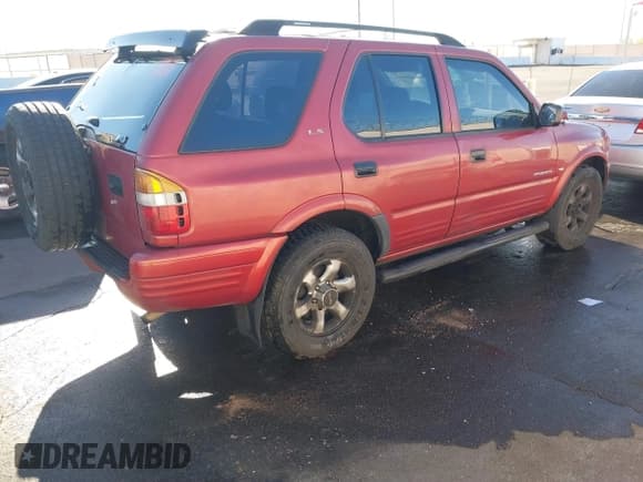 ✅ 1999 Isuzu Rodeo S • VIN: 4S2CK58W3X4307201 • Lot: 41884901. Listed on IAAI with 236,970 mi. Free auction sales archive from the USA and detailed vehicle history report at DreamBid. Image 4.