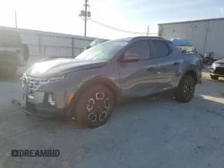 ✅ 2023 Hyundai Santa Cruz SEL • VIN: 5NTJCDAE7PH076424 • Лот: 81056155. Опубликован ранее на Copart с пробегом 23 761 миль. Бесплатный доступ к архиву аукционных продаж из США и подробный отчёт об истории автомобиля на DreamBid. Изображение 1.