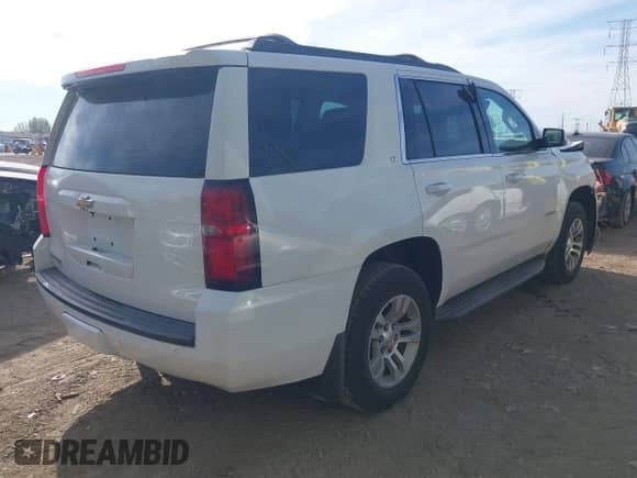 2015 Chevrolet Tahoe LT z VIN 1GNSKBKC3FR279459, wystawiony jako IAAI lot #43349972 z przebiegiem 112 043 mil mil oraz . Historia ofert i sprzedaży dostępna na DreamBid. Obrazek 4.