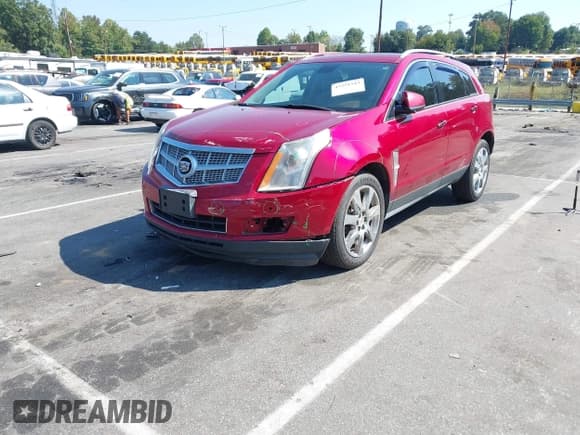 ✅ 2012 Cadillac SRX Performance Collection • VIN: 3GYFNBE31CS571210 • Lot: 43251543. Listed on IAAI with 186,568 mi. Free auction sales archive from the USA and detailed vehicle history report at DreamBid. Image 2.