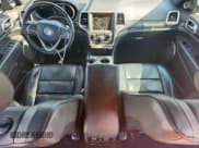 ✅ 2014 Jeep Grand Cherokee • VIN: 1C4RJEJMXEC585632 • Lot: 62036515. Listed on Copart with 148,660 mi. Free auction sales archive from the USA and detailed vehicle history report at DreamBid. Image 8.