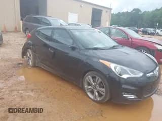 2012 Hyundai Veloster w/Red Int with VIN KMHTC6AD0CU076528, listed as a IAAI auction lot 42651736 with 117,125 mi miles and . Bid and sale history available at DreamBid. Image 1.