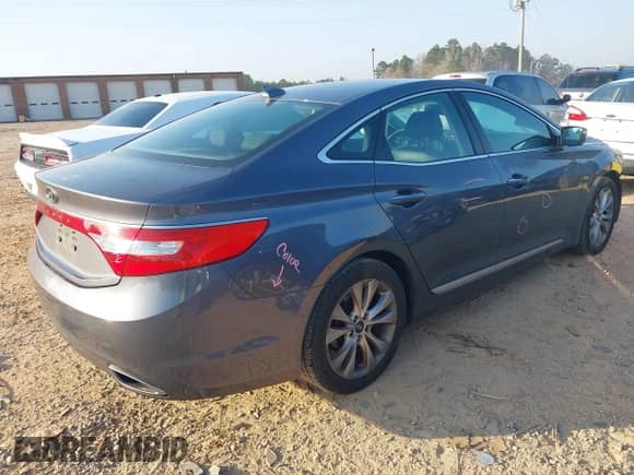 2013 Hyundai Azera z VIN KMHFG4JG6DA243655, wystawiony jako IAAI lot #41802097 z przebiegiem 135 677 mil mil oraz . Historia ofert i sprzedaży dostępna na DreamBid. Obrazek 4.