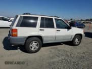 ✅ 1997 Jeep Grand Cherokee Laredo • VIN: 1J4GZ58YXVC739727 • Lot: 70745445. Listed on Copart with Not provided. Free auction sales archive from the USA and detailed vehicle history report at DreamBid. Image 3.