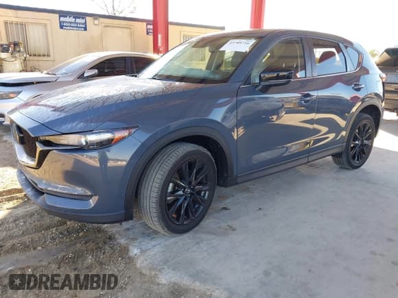 ✅ 2021 Mazda CX-5 Carbon Edition • VIN: JM3KFACY6M0352026 • Lot: 43709716. Listed on IAAI with 60,193 mi. Free auction sales archive from the USA and detailed vehicle history report at DreamBid. Image 18.