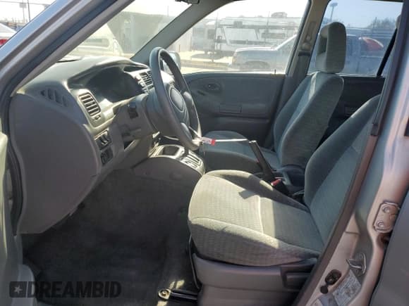 ✅ 2003 Suzuki Vitara • VIN: 2S3TE52V136105762 • Lot: 54796825. Listed on Copart with 164,564 mi. Free auction sales archive from the USA and detailed vehicle history report at DreamBid. Image 7.