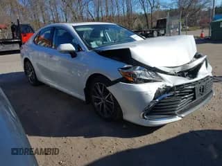 2022 Toyota Camry Hybrid XLE with VIN 4T1F31AK4NU599424, listed as a IAAI auction lot 40839336 with 68,918 mi miles and . Bid and sale history available at DreamBid. Image 1.