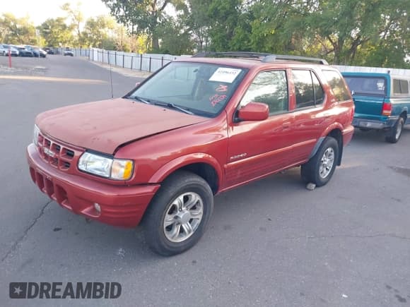 ✅ 2001 Isuzu Rodeo S • VIN: 4S2CK58W414308980 • Lot: 42496432. Listed on IAAI with 166,360 mi. Free auction sales archive from the USA and detailed vehicle history report at DreamBid. Image 2.