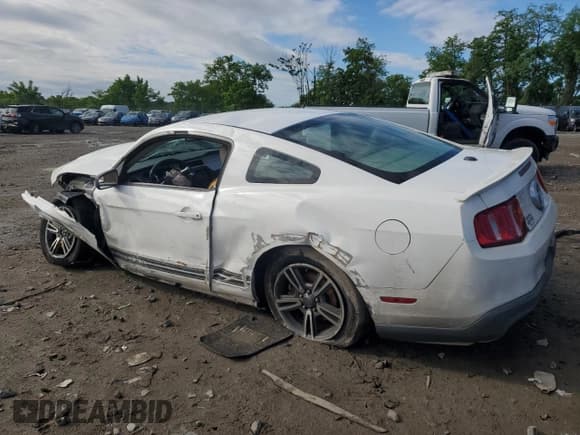 ✅ 2011 Ford Mustang V6 • VIN: 1ZVBP8AM9B5130219 • Lot: 57945885. Listed on Copart with Not provided. Free auction sales archive from the USA and detailed vehicle history report at DreamBid. Image 2.