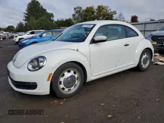 ✅ 2015 Volkswagen Beetle 1.8T • VIN: 3VWF17AT7FM653338 • Lot: 86269485. Listed on Copart with 79,534 mi. Free auction sales archive from the USA and detailed vehicle history report at DreamBid. Image 1.