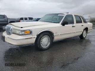 ✅ 1995 Lincoln Town Car Cartier • VIN: 1LNLM83W2SY603452 • Lot: 55756595. Listed on Copart with 243,394 mi. Free auction sales archive from the USA and detailed vehicle history report at DreamBid. Image 1.