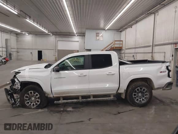 2025 Chevrolet Colorado 4WD Z71 with VIN 1GCPTDEK3S1121299, listed as a IAAI auction lot 43455862 with 2,148 mi miles and . Bid and sale history available at DreamBid. Image 14.
