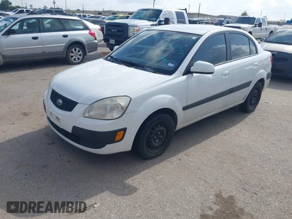 ✅ 2009 Kia Rio LX • VIN: KNADE223696518773 • Лот: 42692771. Опубликован ранее на IAAI с пробегом 156 430 миль. Бесплатный доступ к архиву аукционных продаж из США и подробный отчёт об истории автомобиля на DreamBid. Изображение 2.