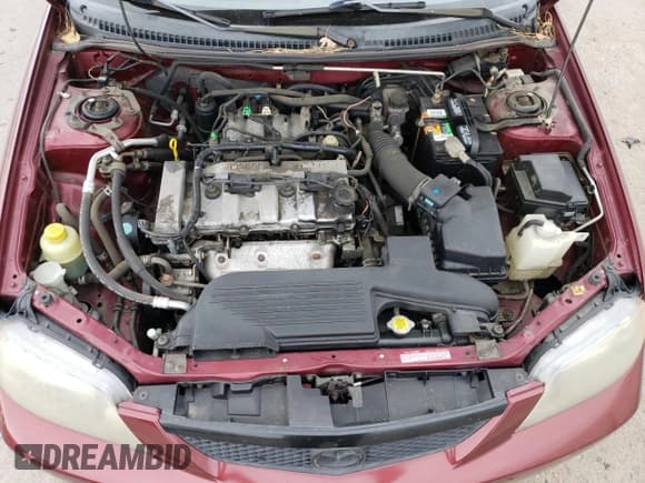 ✅ 2002 Mazda Protege DX • VIN: JM1BJ225120627724 • Lot: 80785684. Wystawiony na Copart z przebiegiem 104 013 mil. Bezpłatny archiwum sprzedaży aukcyjnych z USA i szczegółowy raport historii pojazdu na DreamBid. Zdjęcie 12.