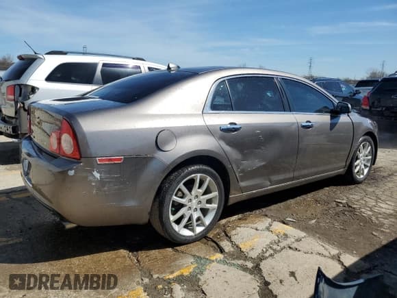 ✅ 2012 Chevrolet Malibu LTZ • VIN: 1G1ZG5E74CF281946 • Lot: 49991684. Listed on Copart with 152,608 mi. Free auction sales archive from the USA and detailed vehicle history report at DreamBid. Image 3.