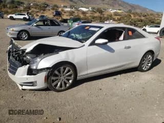 ✅ 2015 Cadillac ATS • VIN: 1G6AJ1RX6F0114099 • Лот: 63977673. Опубликован ранее на Copart с пробегом 107 561 миль. Бесплатный доступ к архиву аукционных продаж из США и подробный отчёт об истории автомобиля на DreamBid. Изображение 1.