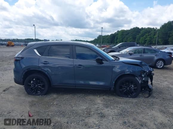 ✅ 2023 Mazda CX-5 S Carbon Edition • VIN: JM3KFBCM3P0262534 • Лот: 42740448. Опубликован ранее на IAAI с пробегом 10 257 миль. Бесплатный доступ к архиву аукционных продаж из США и подробный отчёт об истории автомобиля на DreamBid. Изображение 14.
