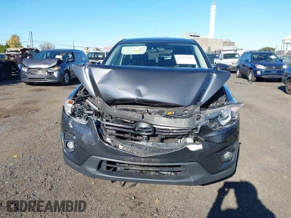 ✅ 2016 Mazda CX-5 Touring • VIN: JM3KE4CY2G0773542 • Lot: 43512519. Listed on IAAI with 64,878 mi. Free auction sales archive from the USA and detailed vehicle history report at DreamBid. Image 12.