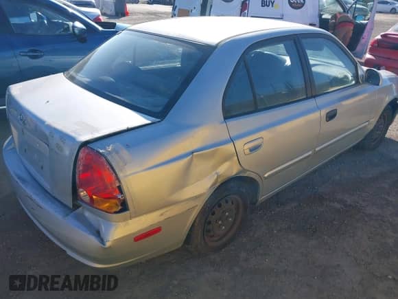 2004 Hyundai Accent GL with VIN KMHCG45C14U547954, listed as a IAAI auction lot 41350219 with 138,436 mi miles and . Bid and sale history available at DreamBid. Image 4.