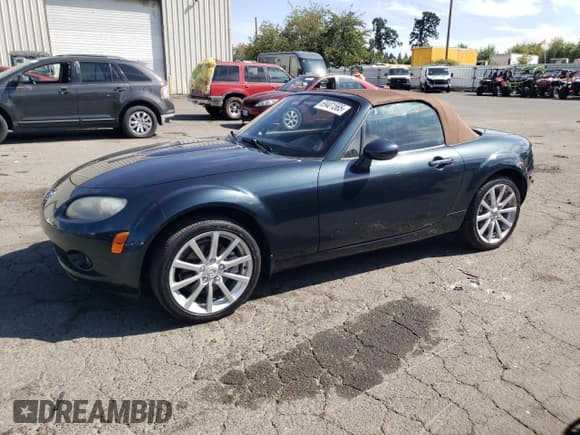 ✅ 2006 Mazda MX-5 Miata Sport • VIN: JM1NC25F260109543 • Лот: 69401565. Опубликован ранее на Copart с пробегом 143 737 миль. Бесплатный доступ к архиву аукционных продаж из США и подробный отчёт об истории автомобиля на DreamBid. Изображение 1.