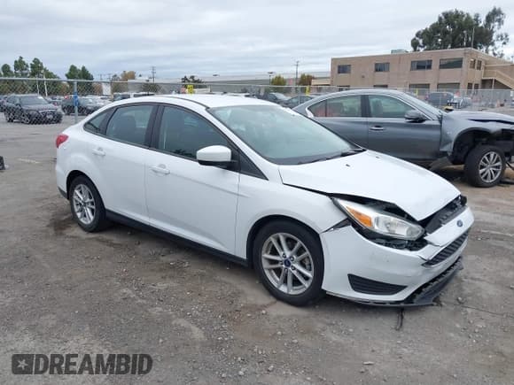 ✅ 2018 Ford Focus SE • VIN: 1FADP3FE0JL331278 • Lot: 43682633. Listed on IAAI with 99,011 mi. Free auction sales archive from the USA and detailed vehicle history report at DreamBid. Image 1.