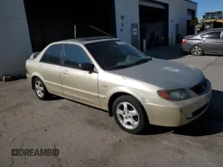 ✅ 2002 Mazda Protege DX • VIN: JM1BJ225621602392 • Lot: 80700724. Wystawiony na Copart z przebiegiem 351 584 mil. Bezpłatny archiwum sprzedaży aukcyjnych z USA i szczegółowy raport historii pojazdu na DreamBid. Zdjęcie 4.