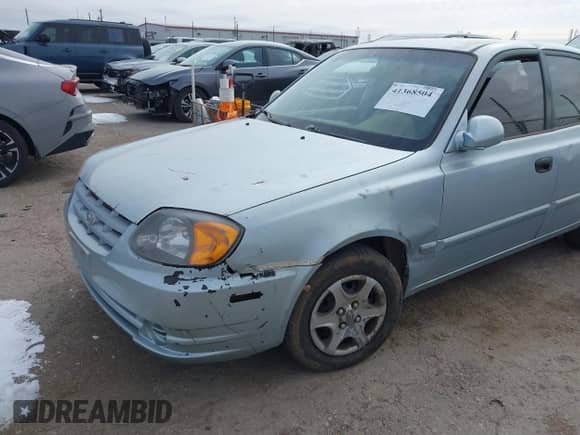 2005 Hyundai Accent GLS z VIN KMHCG45C65U576092, wystawiony jako IAAI lot #41368504 z przebiegiem 162 208 mil mil oraz . Historia ofert i sprzedaży dostępna na DreamBid. Obrazek 6.