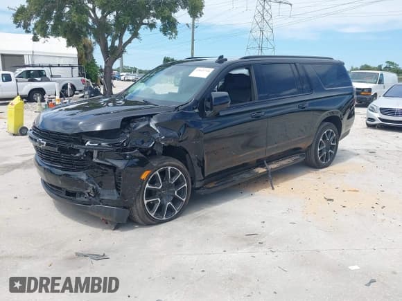 ✅ 2024 Chevrolet Suburban • VIN: 1GNSCEKT8RR350187 • Lot: 43045718. Listed on IAAI with 28,587 mi. Free auction sales archive from the USA and detailed vehicle history report at DreamBid. Image 2.