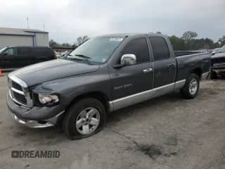 2003 Dodge 1500 ST with VIN 1D7HA18Z23S211434, listed as a Copart auction lot 82299034 with 227,167 mi miles and Salvage title. Bid and sale history available at DreamBid. Image 1.
