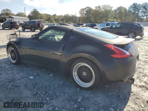 ✅ 2009 Nissan 370Z • VIN: JN1AZ44EX9M404083 • Lot: 91008375. Listed on Copart with 185,773 mi. Free auction sales archive from the USA and detailed vehicle history report at DreamBid. Image 2.